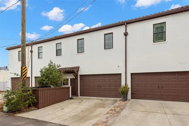 a front view of a house with garage