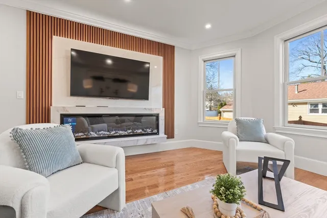 a living room with furniture and a flat screen tv
