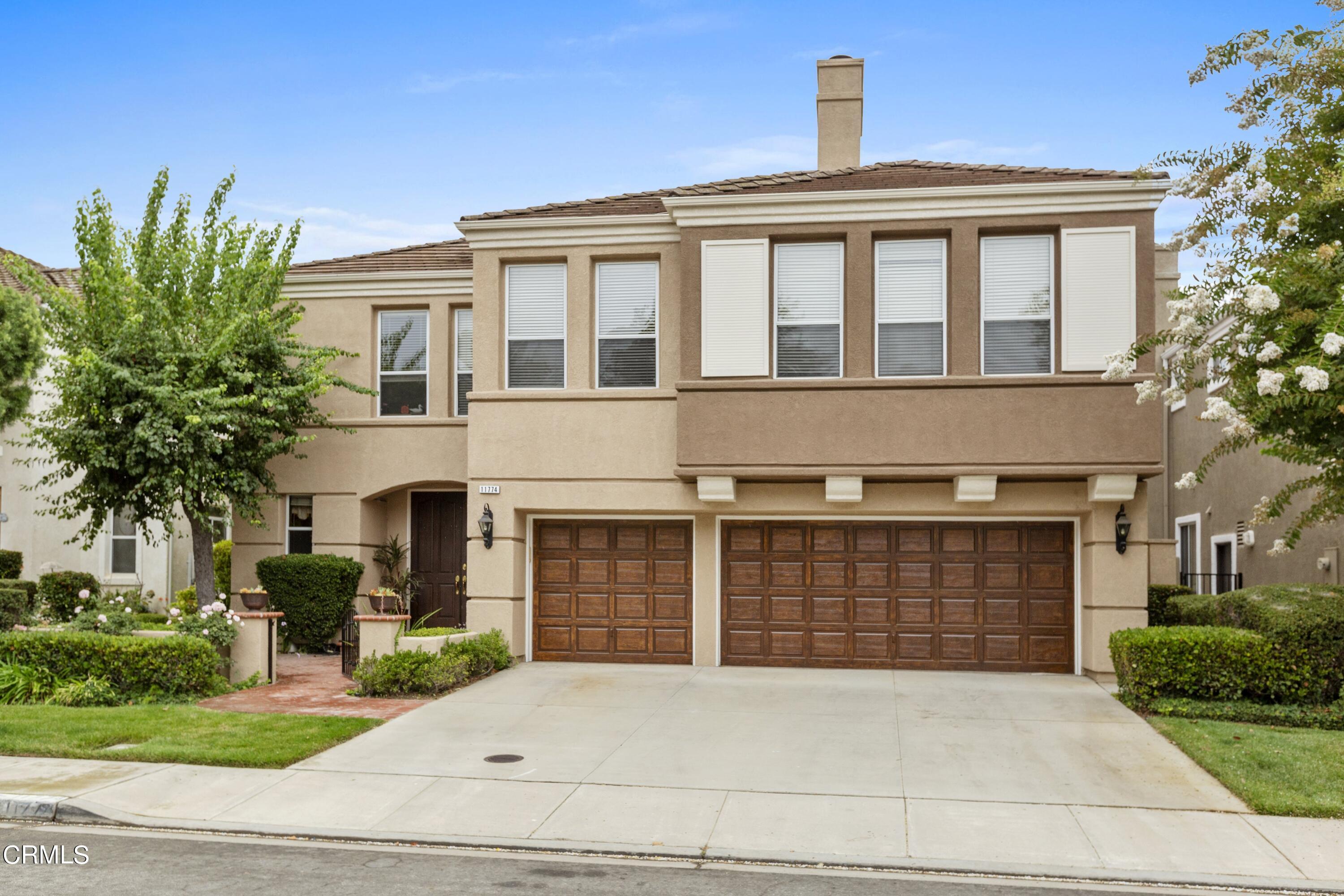 11774 Pinedale Road Moorpark, CA 93021 - Photo 1 of 37 a front view of a house with a yard and garage