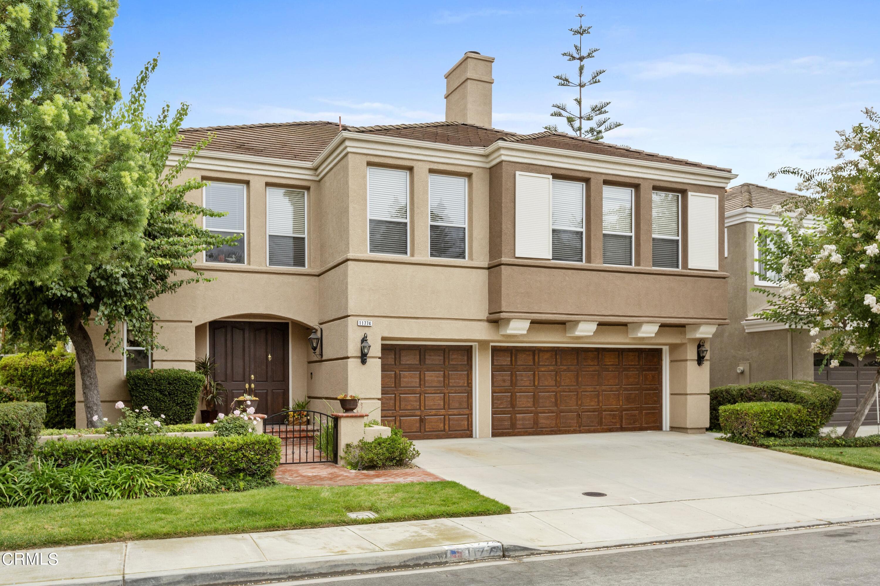 11774 Pinedale Road Moorpark, CA 93021 - Photo 2 of 37 a front view of a house with yard and parking