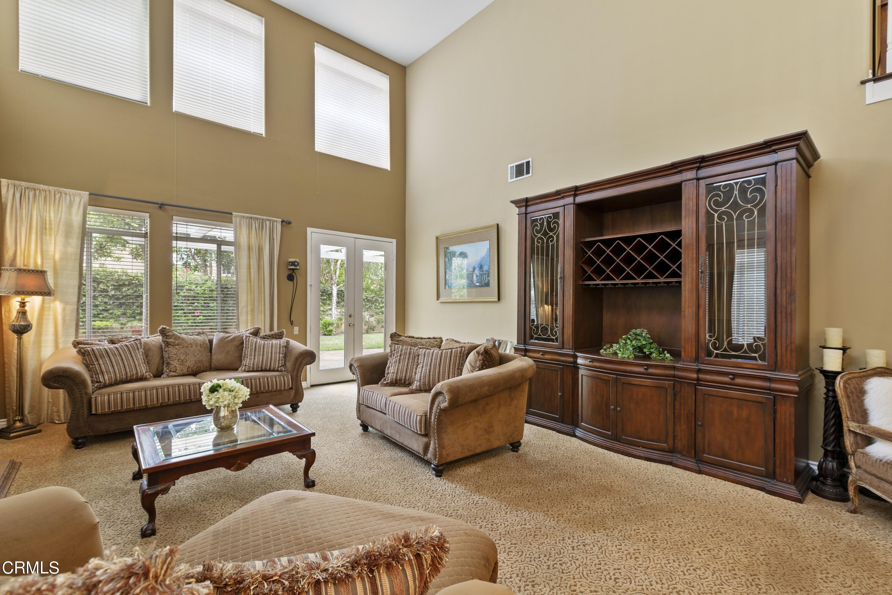 11774 Pinedale Road Moorpark, CA 93021 - Photo 11 of 37 a living room with furniture and large windows