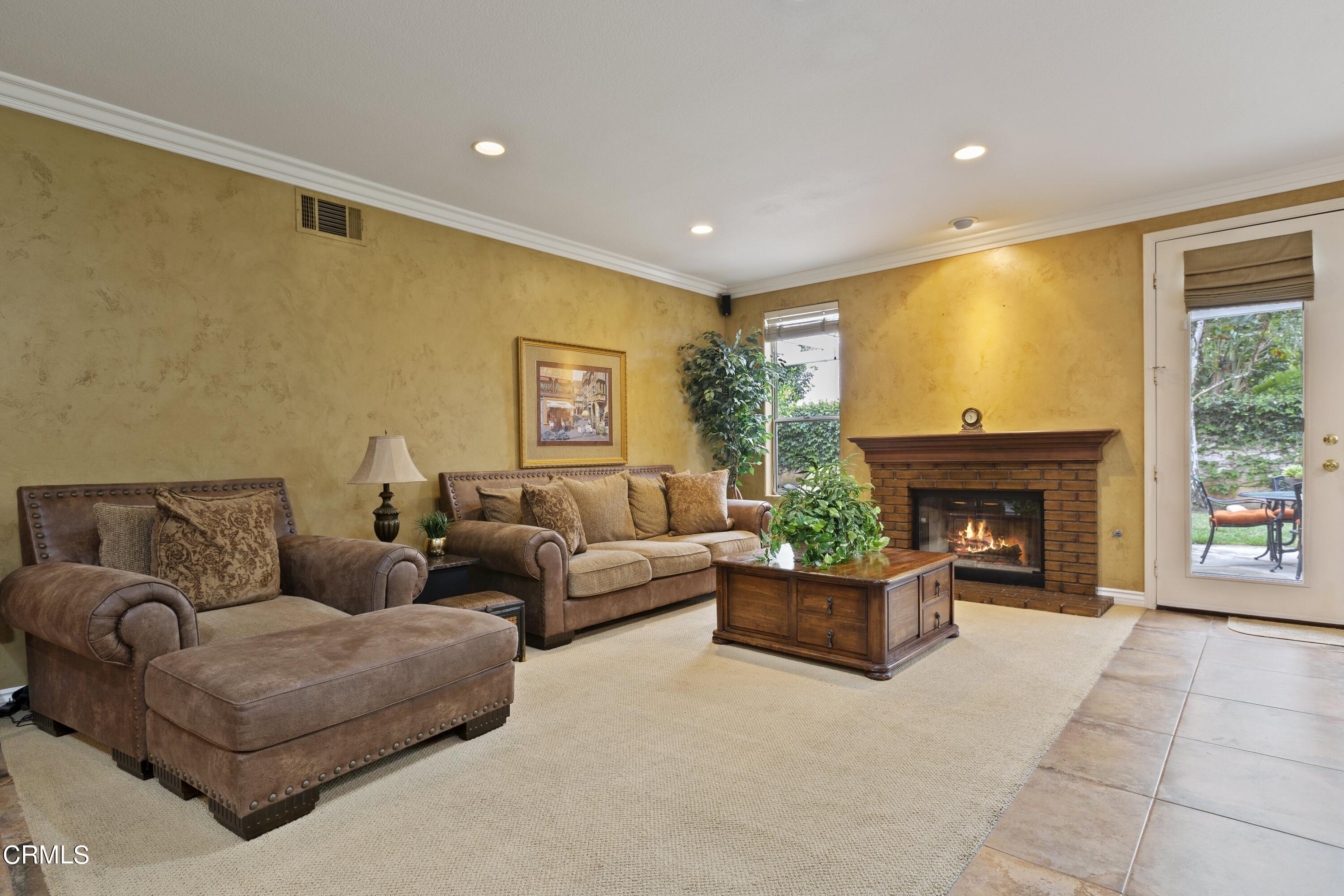11774 Pinedale Road Moorpark, CA 93021 - Photo 16 of 37 a living room with furniture and a fireplace