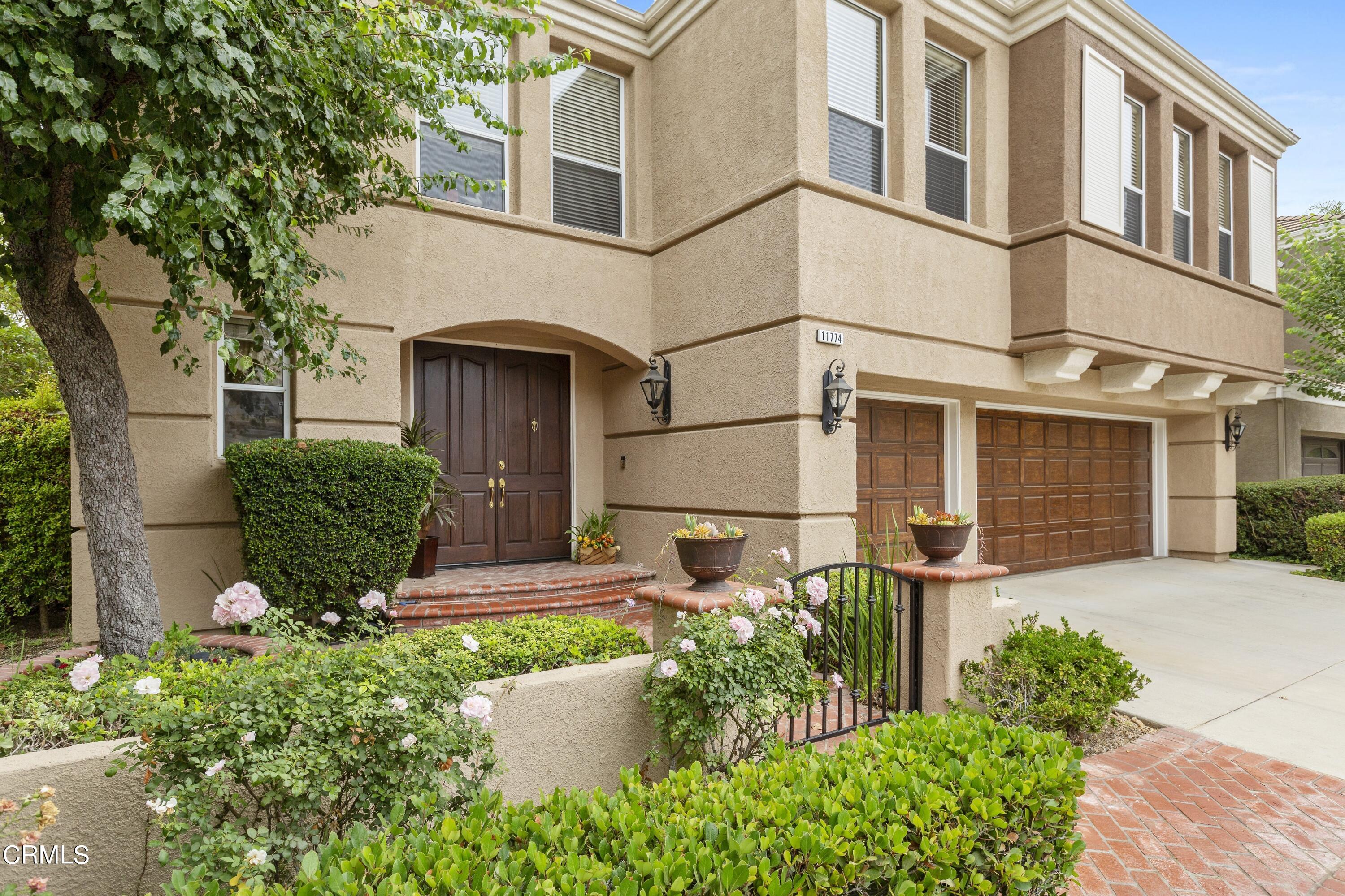 11774 Pinedale Road Moorpark, CA 93021 - Photo 3 of 37 a front view of a house with garden