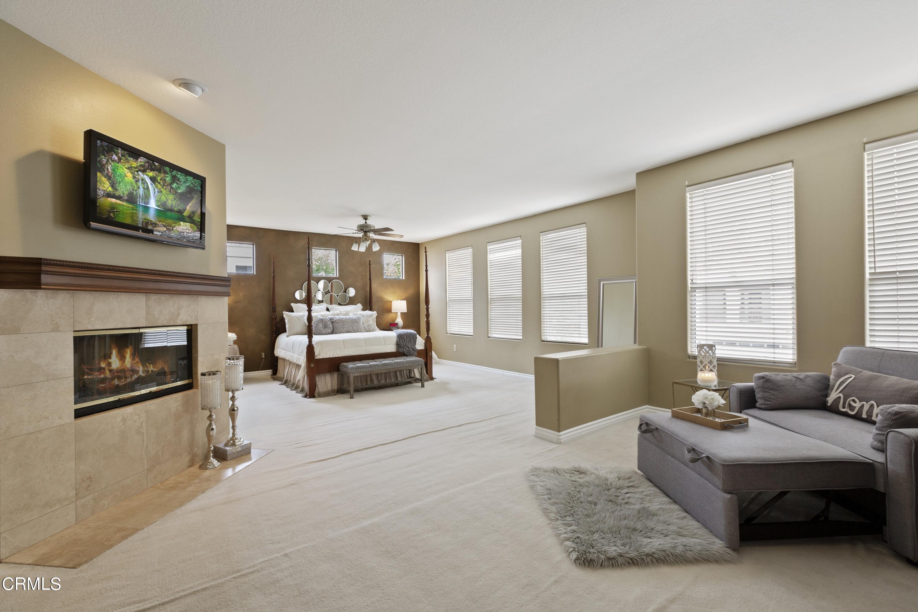 11774 Pinedale Road Moorpark, CA 93021 - Photo 23 of 37 a living room with furniture and a fireplace