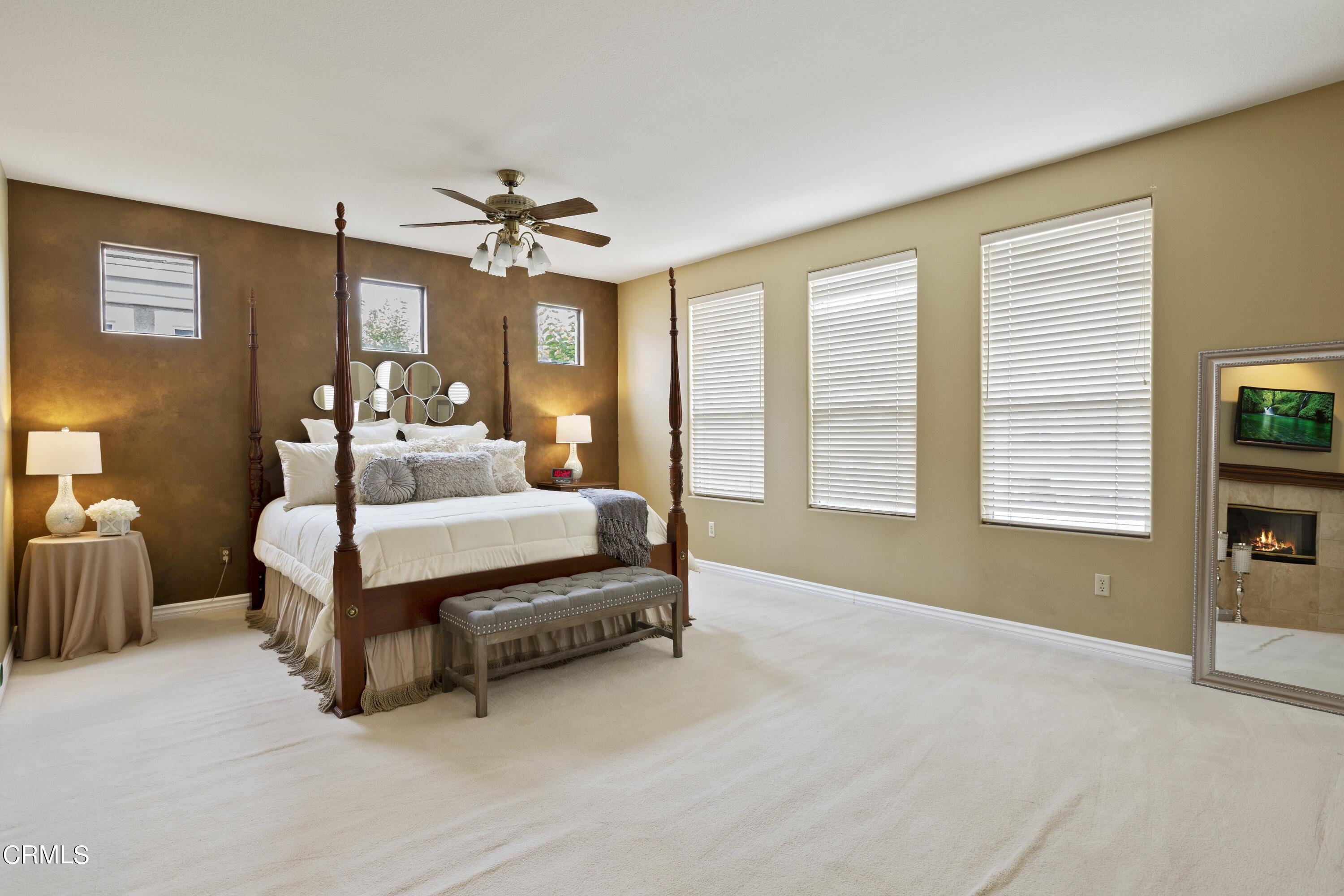 11774 Pinedale Road Moorpark, CA 93021 - Photo 24 of 37 a bedroom with bed and a chandelier