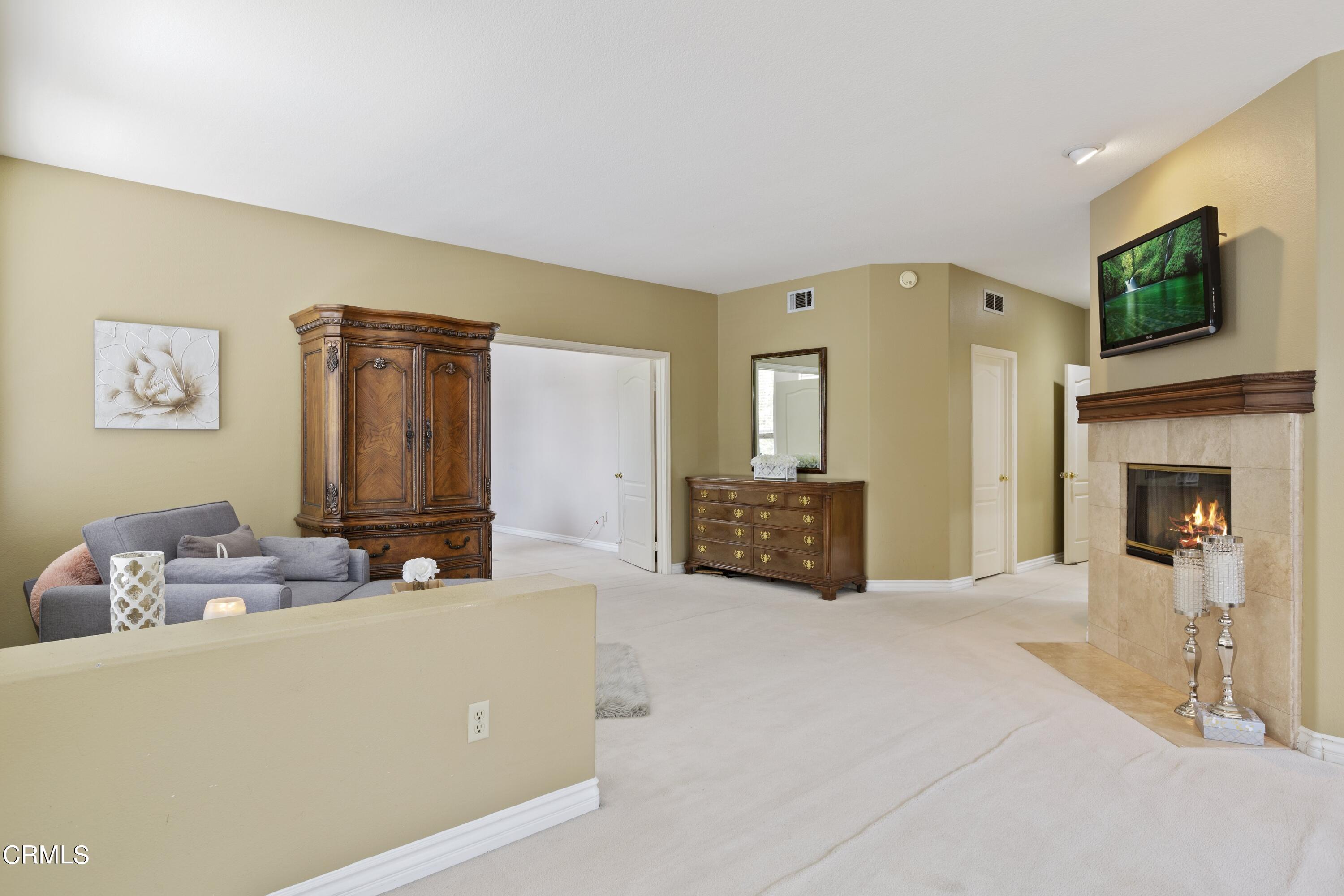 11774 Pinedale Road Moorpark, CA 93021 - Photo 25 of 37 a living room with furniture and a flat screen tv