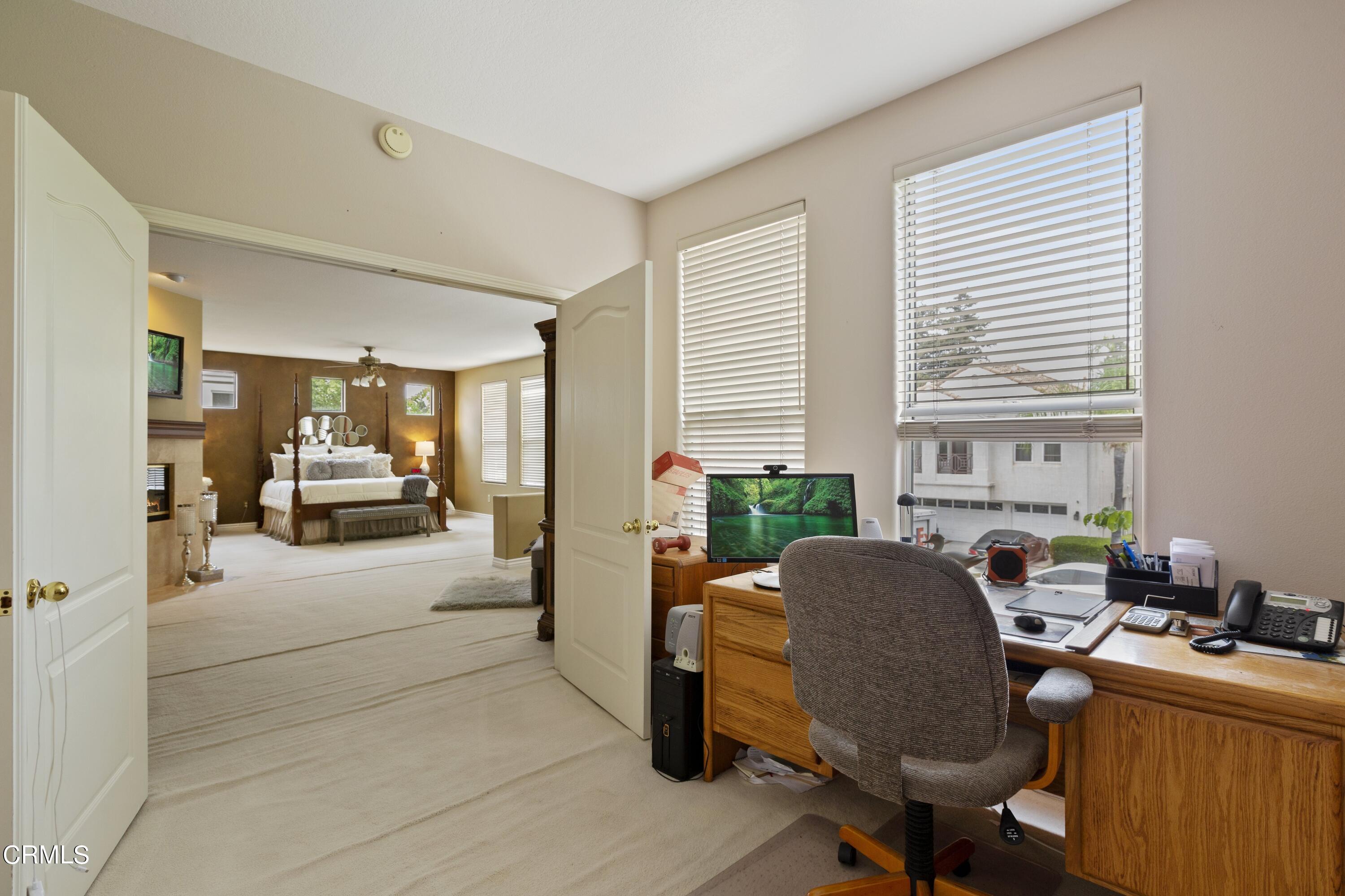 11774 Pinedale Road Moorpark, CA 93021 - Photo 26 of 37 a view of a workspace with furniture and a window
