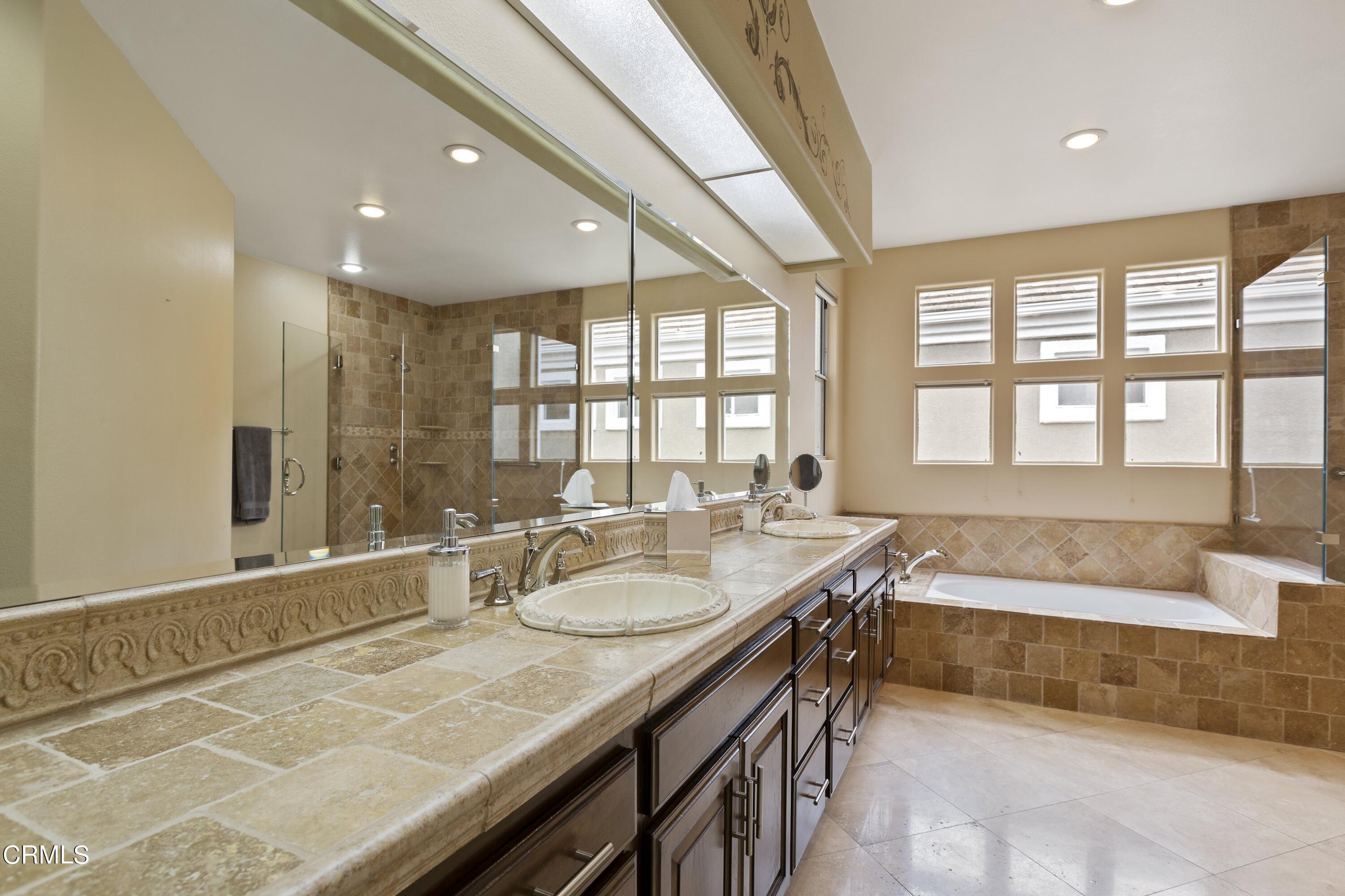 11774 Pinedale Road Moorpark, CA 93021 - Photo 27 of 37 a bathroom with a tub a sink and a large window
