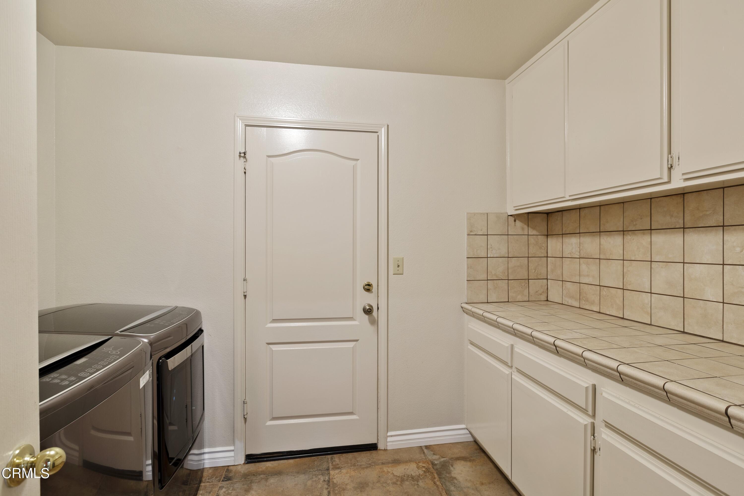11774 Pinedale Road Moorpark, CA 93021 - Photo 31 of 37 a bathroom with a sink and cabinets