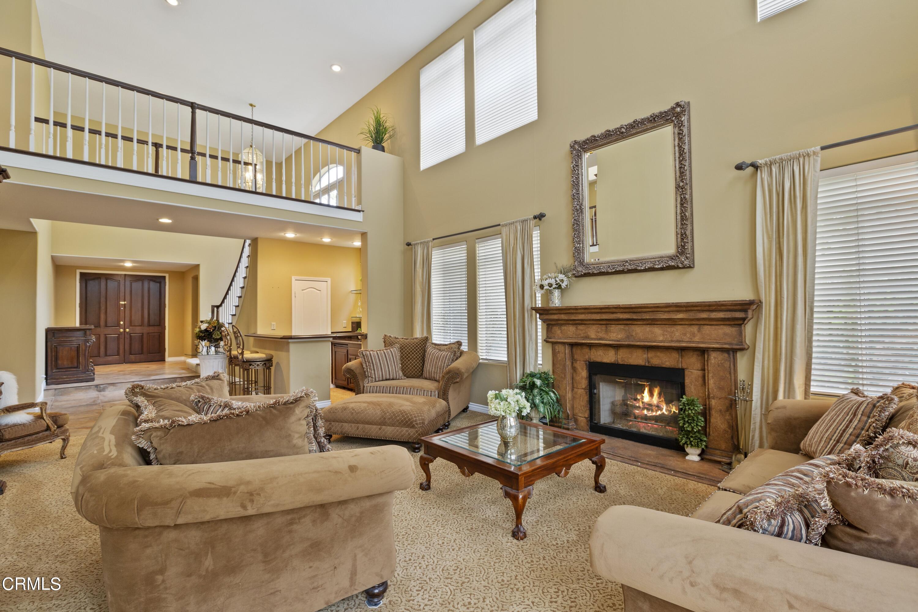 11774 Pinedale Road Moorpark, CA 93021 - Photo 9 of 37 a living room with furniture and a fireplace