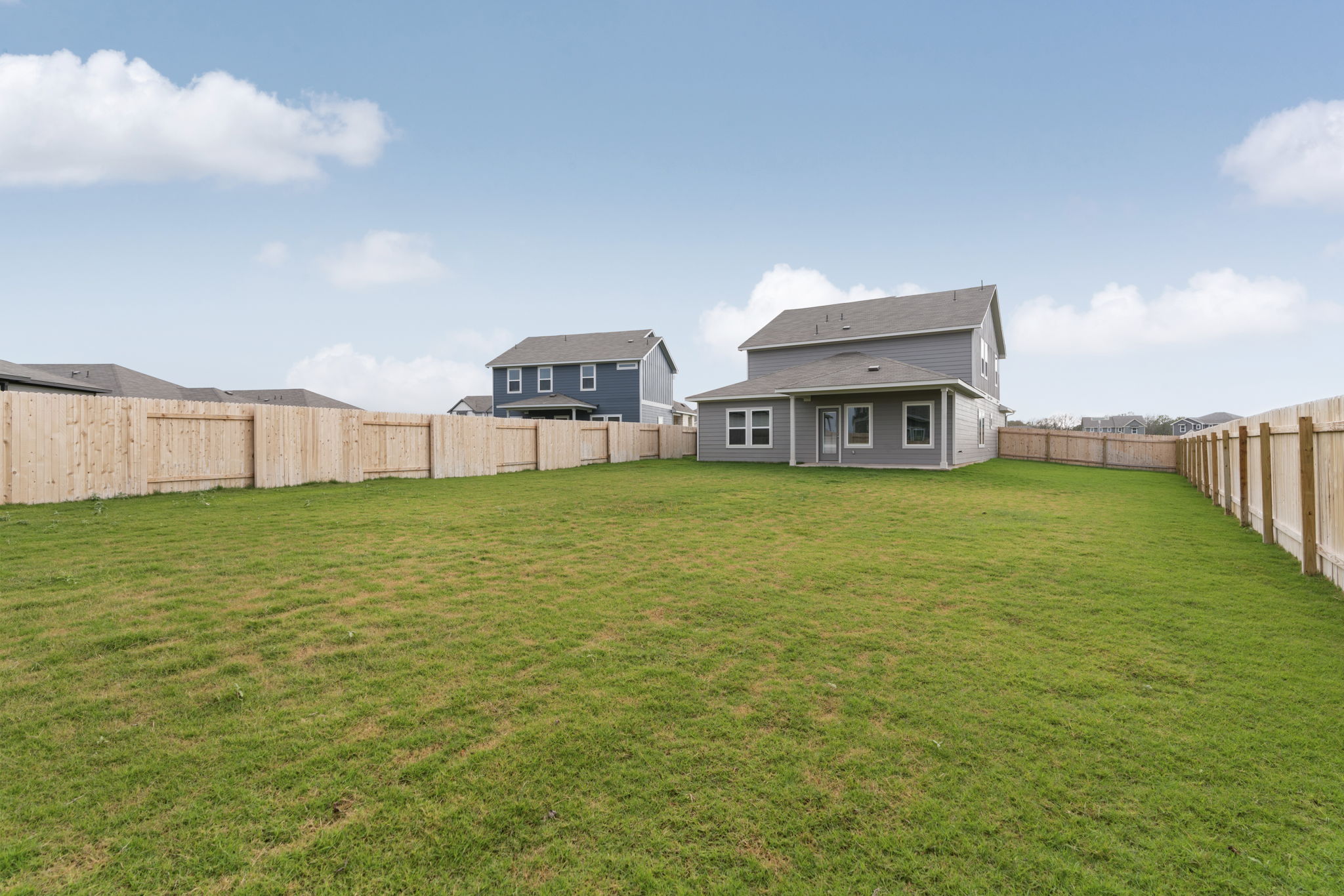 104 Boondoggle Ridge Cedar Creek, TX 78612 - Photo 31 of 33 a view of a house with a yard