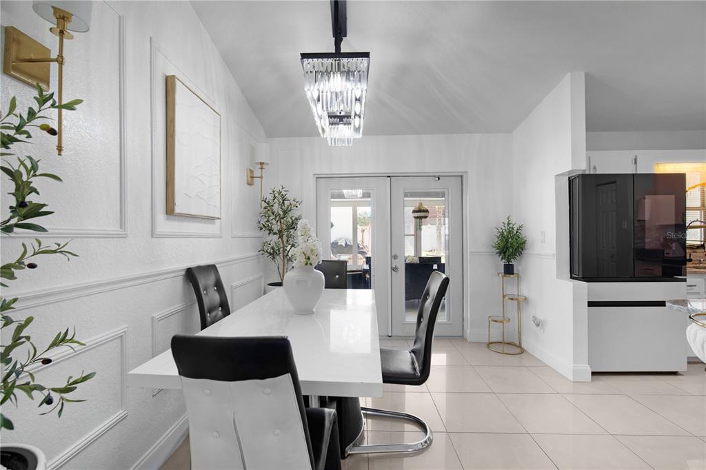 16285 Southwest 21st Court Ocala, FL 34473 - Photo 11 of 40 a view of a livingroom with furniture and a flat screen tv