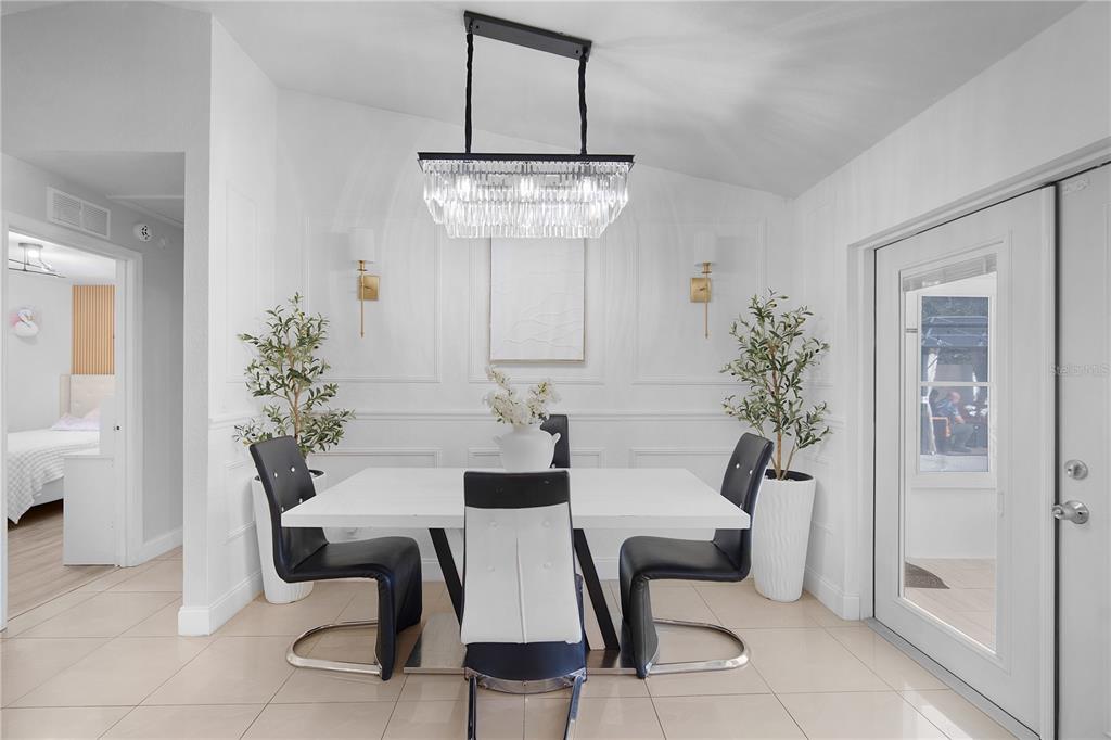 16285 Southwest 21st Court Ocala, FL 34473 - Photo 12 of 40 a dining room with furniture and chandelier