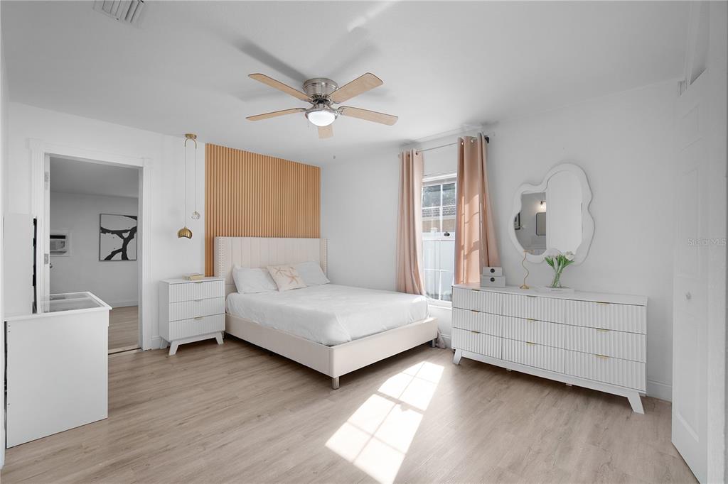 16285 Southwest 21st Court Ocala, FL 34473 - Photo 13 of 40 a room with a bed and a chandelier