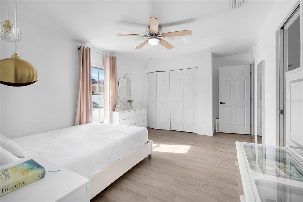 16285 Southwest 21st Court Ocala, FL 34473 - Photo 14 of 40 a bedroom with a bed and a cabinets