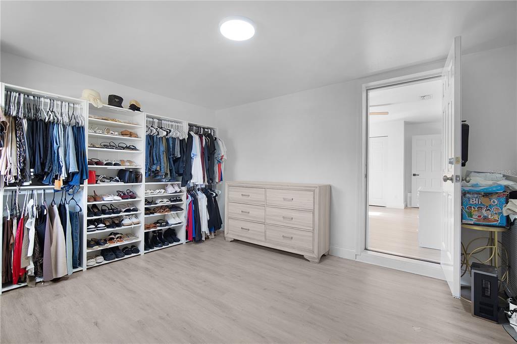 16285 Southwest 21st Court Ocala, FL 34473 - Photo 16 of 40 a view of walk in closet with clothes and shoes
