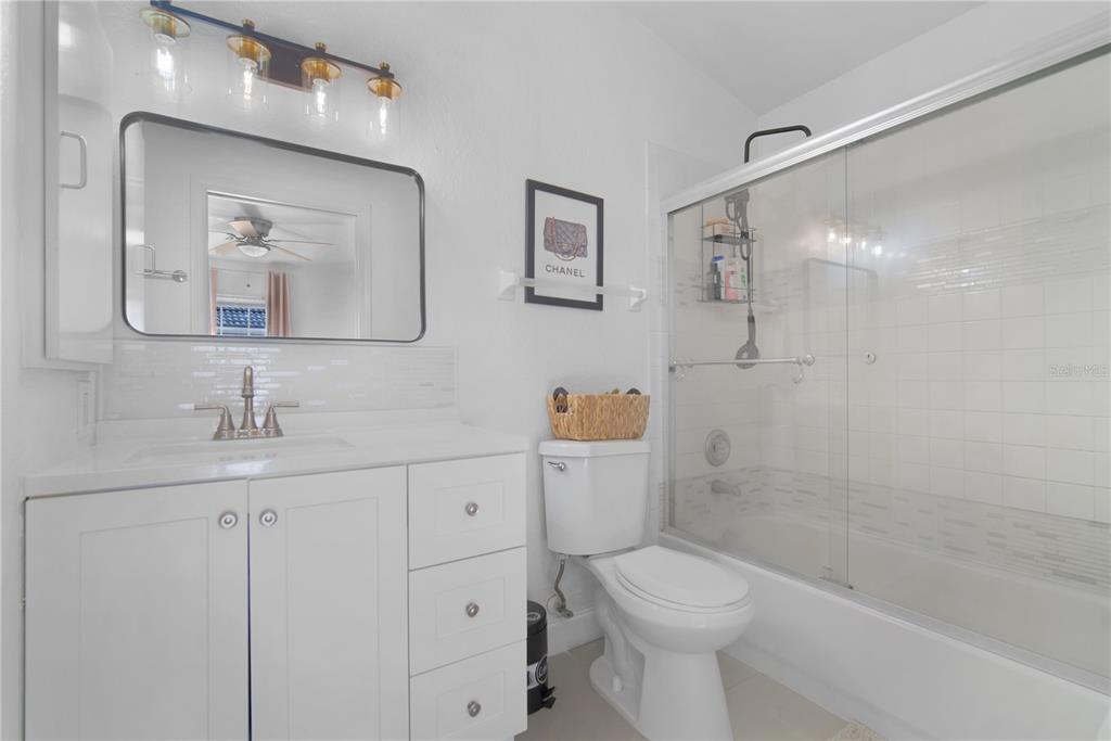 16285 Southwest 21st Court Ocala, FL 34473 - Photo 18 of 40 a bathroom with a sink a toilet and shower