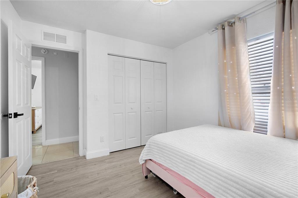 16285 Southwest 21st Court Ocala, FL 34473 - Photo 22 of 40 a bedroom with a bed and a window