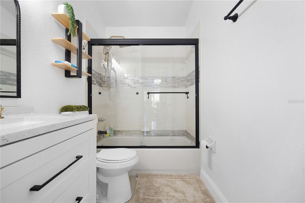 16285 Southwest 21st Court Ocala, FL 34473 - Photo 24 of 40 a bathroom with a granite countertop sink mirror vanity and toilet