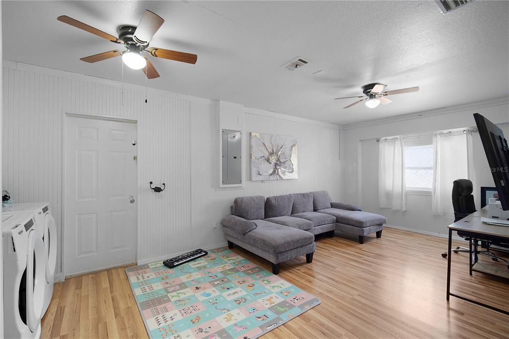 16285 Southwest 21st Court Ocala, FL 34473 - Photo 26 of 40 a living room with furniture and a window
