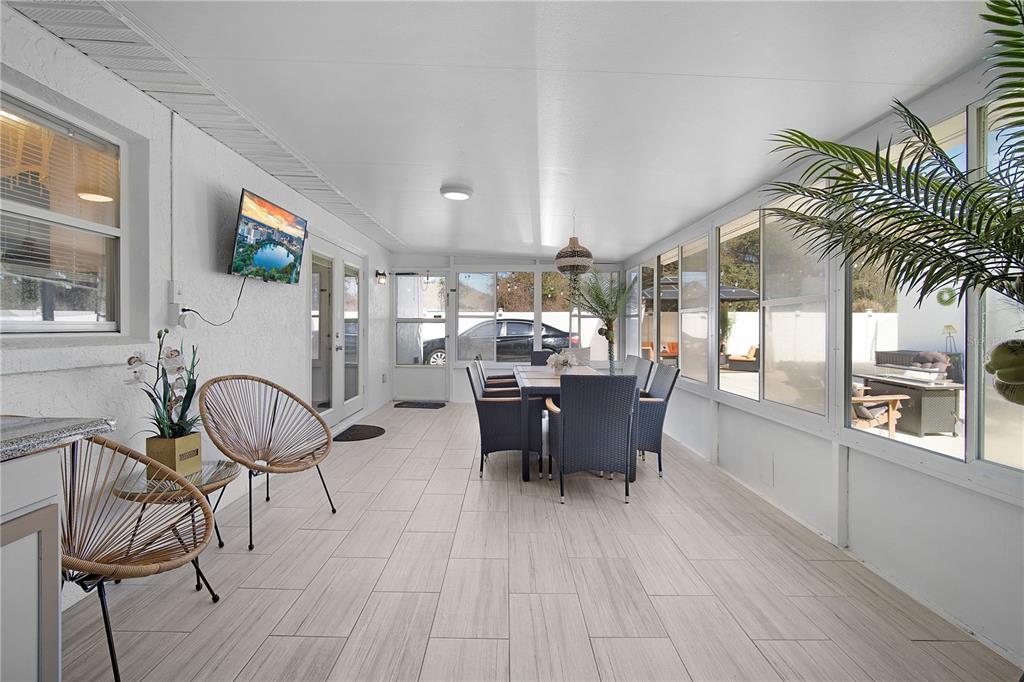 16285 Southwest 21st Court Ocala, FL 34473 - Photo 29 of 40 a dining room with furniture a chandelier and wooden floor