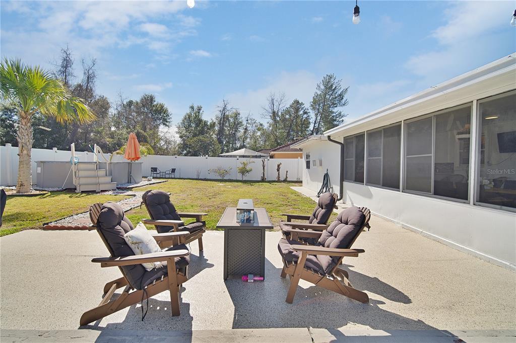 16285 Southwest 21st Court Ocala, FL 34473 - Photo 33 of 40 a view of a swimming pool with a lounge chair