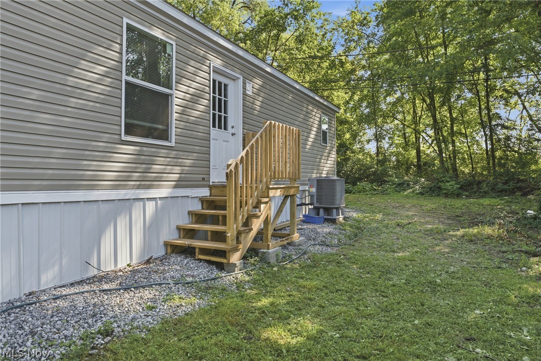 4516 Navarre Road Southwest, Unit 13 Canton, OH 44706 - Photo 30 of 30 Siding exterior with neutral horizontal panels with wood deck