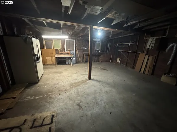 a view of empty room with wooden walls