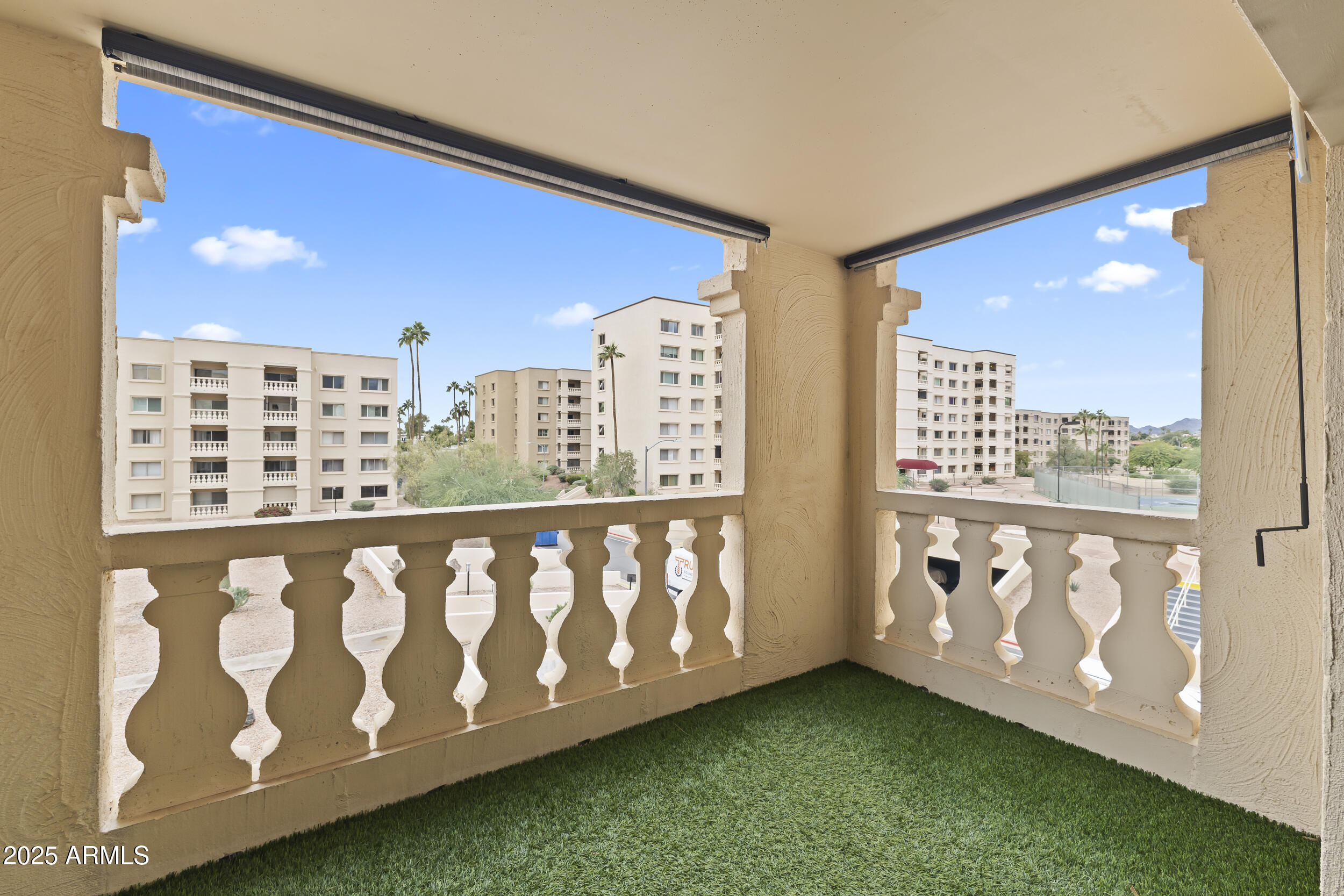 7920 East Camelback Road, Unit 303 Scottsdale, AZ 85251 - Photo 23 of 45 a wooden bench sitting in front of a building