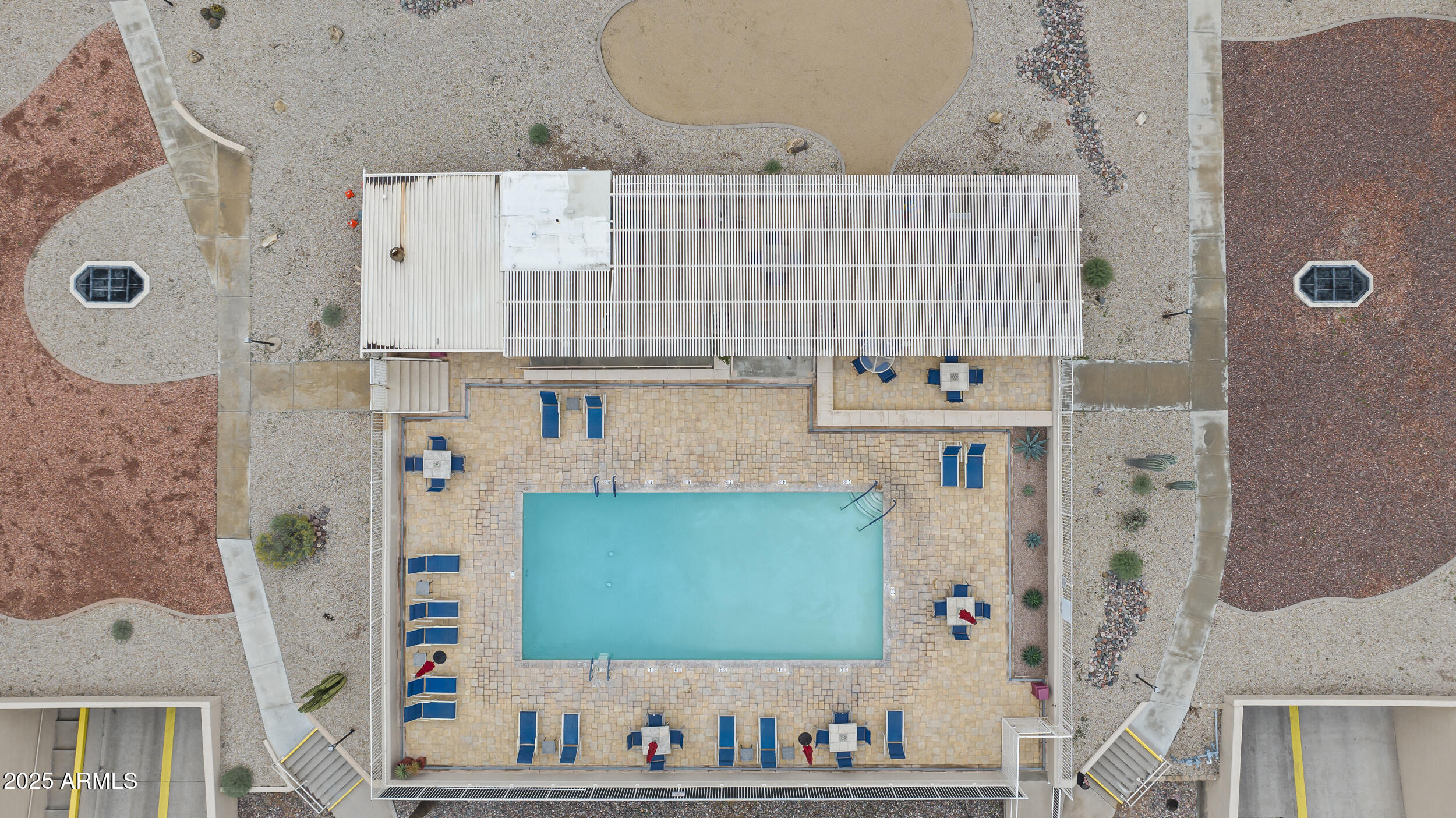 7920 East Camelback Road, Unit 303 Scottsdale, AZ 85251 - Photo 32 of 45 an aerial view of residential houses with outdoor space and parking
