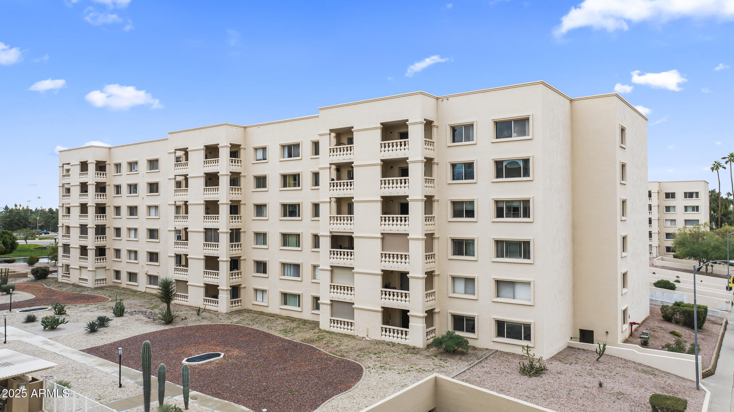 7920 East Camelback Road, Unit 303 Scottsdale, AZ 85251 - Photo 36 of 45 a view of a building with a street