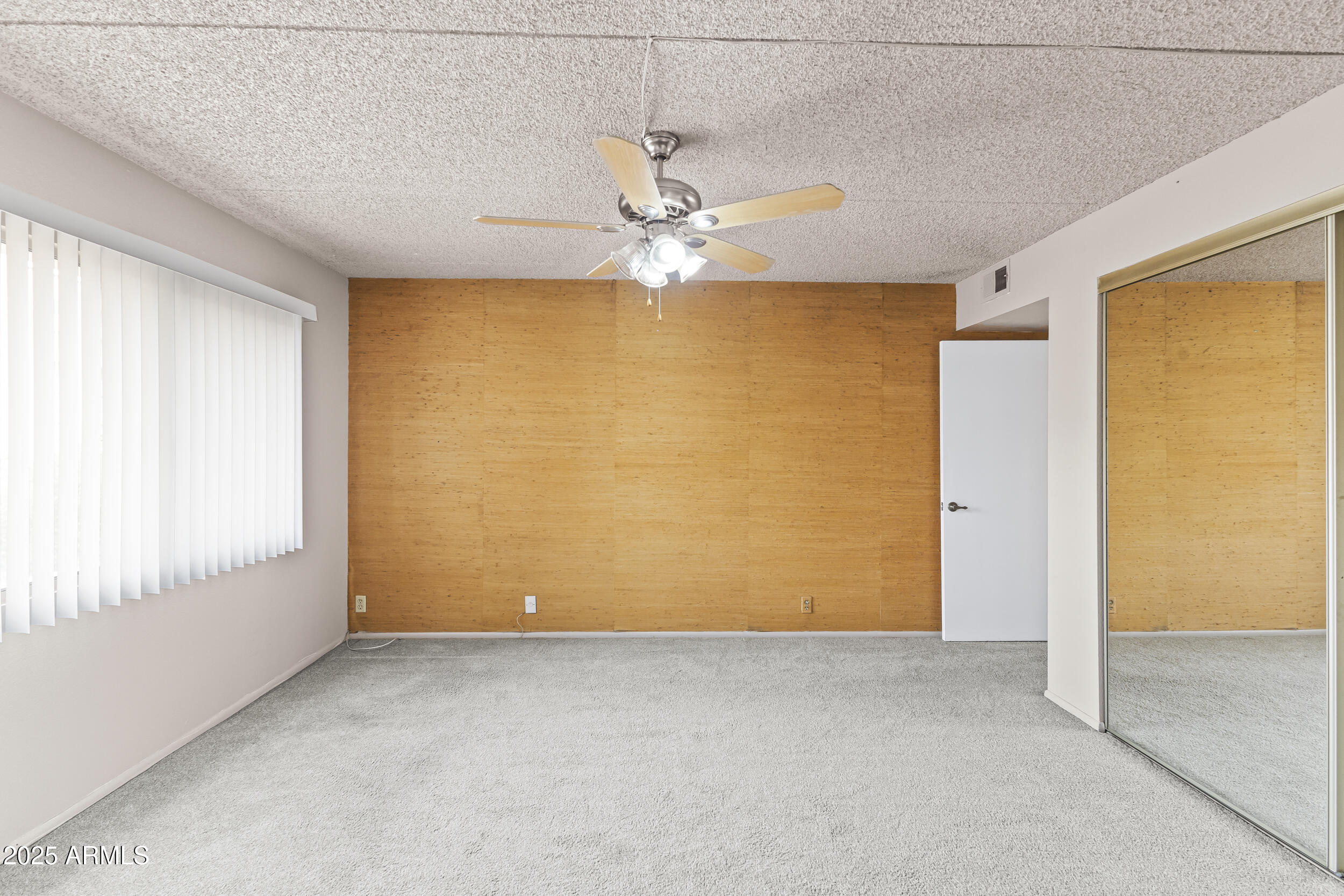 7920 East Camelback Road, Unit 303 Scottsdale, AZ 85251 - Photo 7 of 45 a view of an empty room with a window