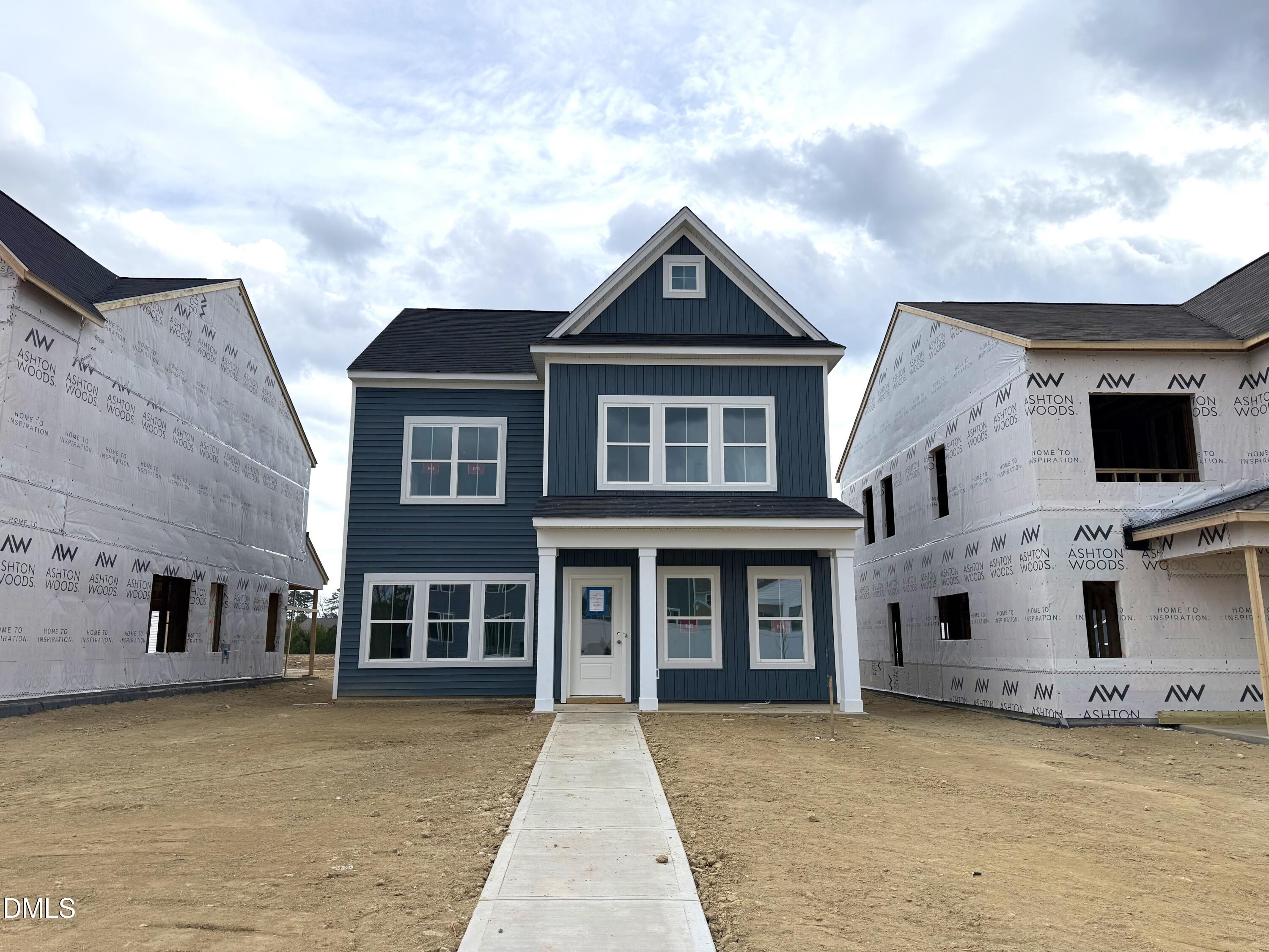 a front view of a house with many windows