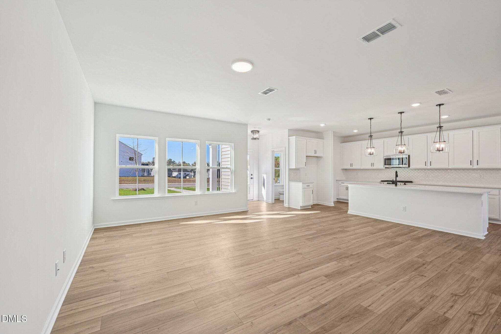 2840 Quarry Road, Unit 174 Rolesville, NC 27571 - Photo 11 of 32 a view of an empty room with a window