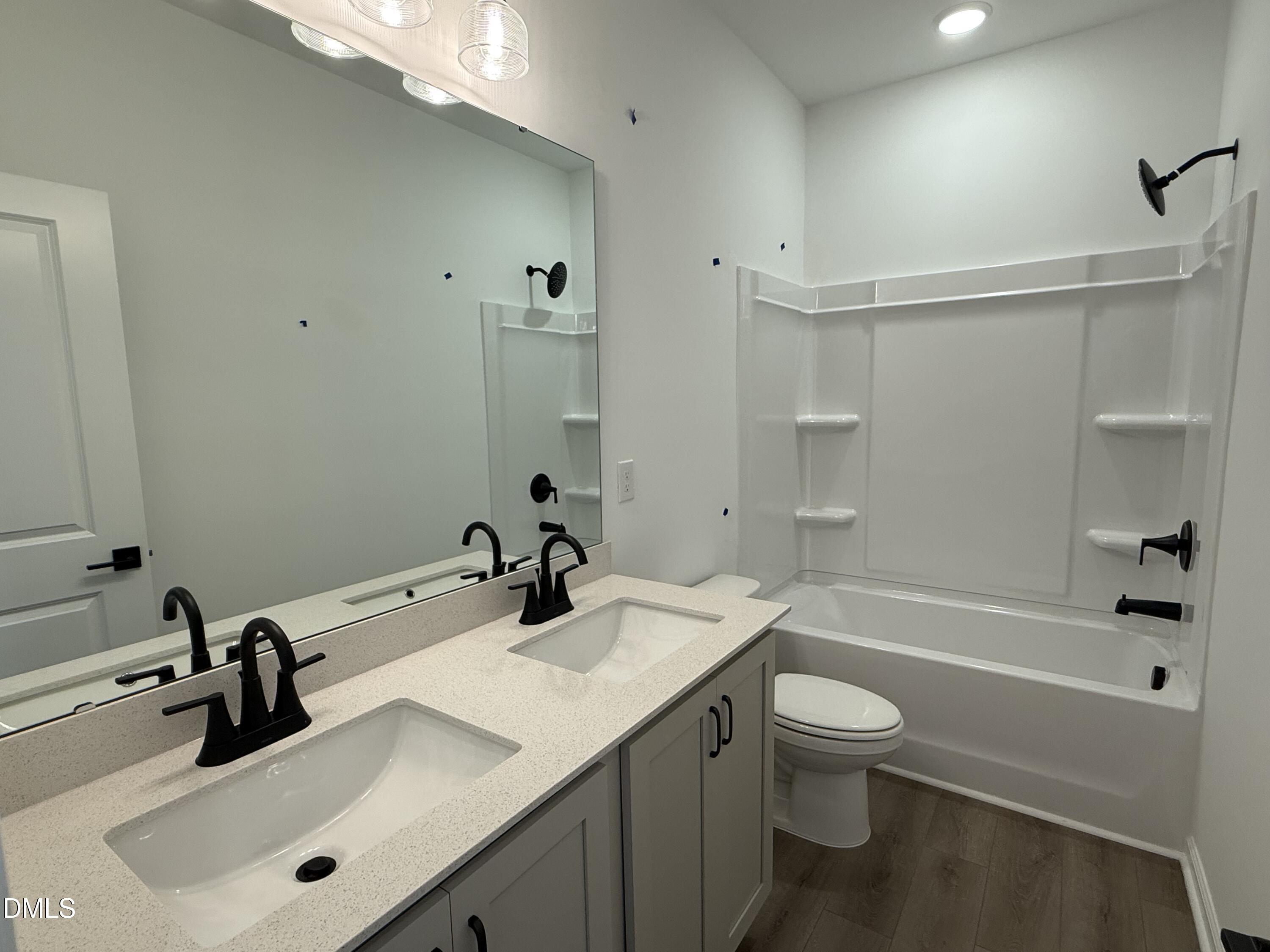2840 Quarry Road, Unit 174 Rolesville, NC 27571 - Photo 13 of 30 a bathroom with a sink toilet tub and shower