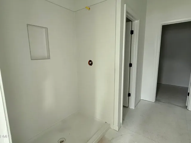 a kitchen with granite countertop a sink and cabinets