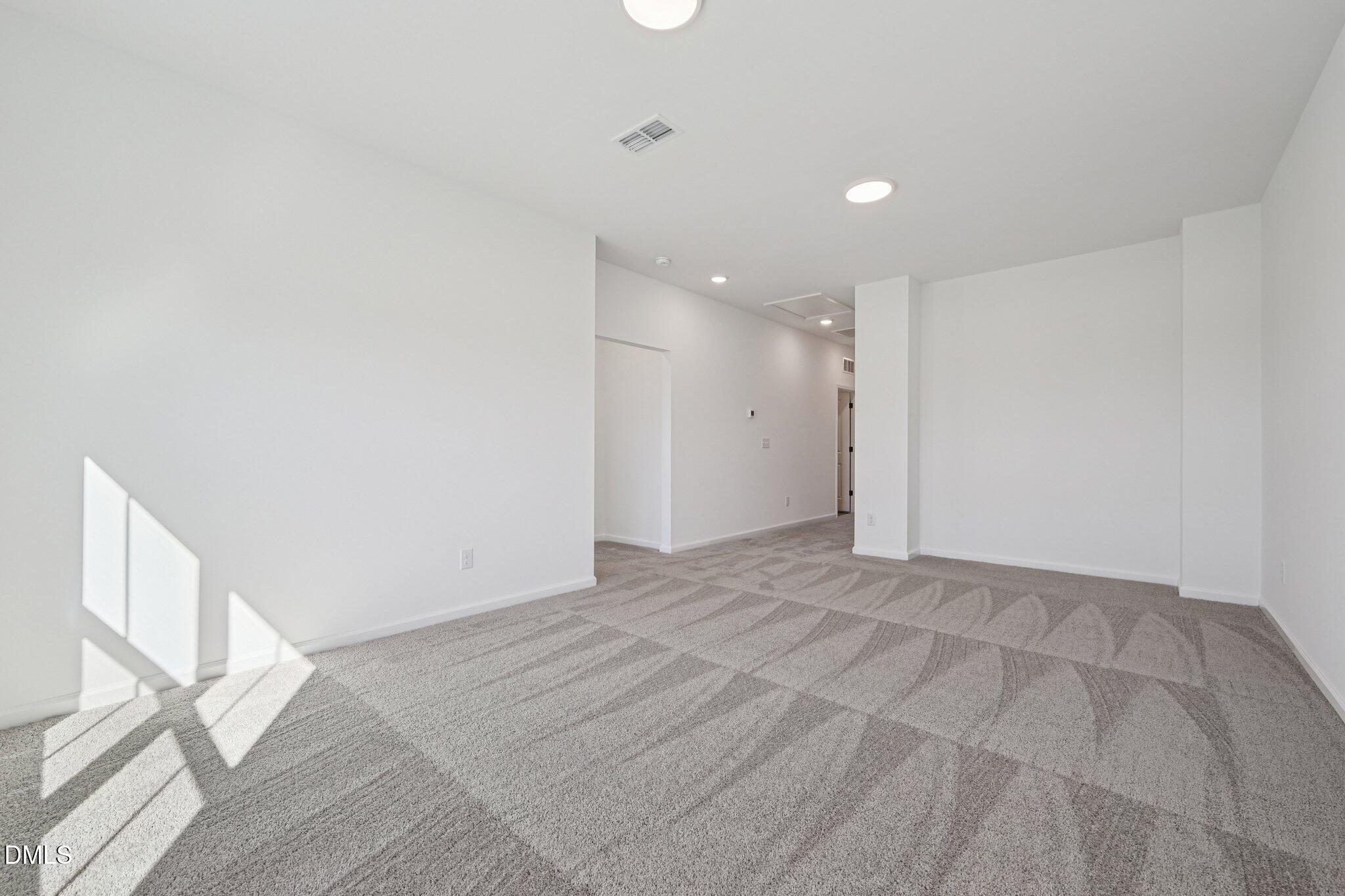 2840 Quarry Road, Unit 174 Rolesville, NC 27571 - Photo 16 of 32 a view of an empty room with a window
