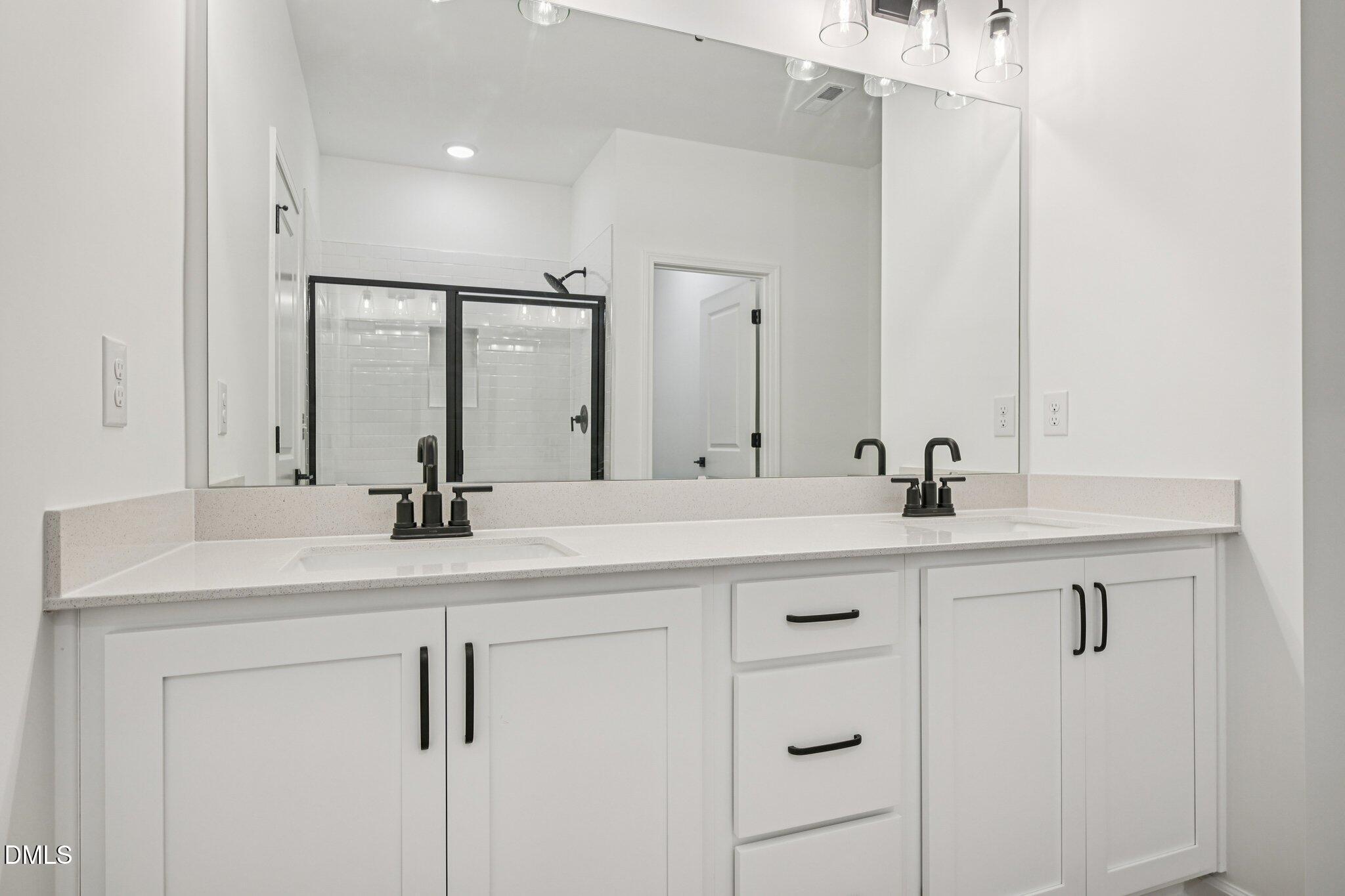 2840 Quarry Road, Unit 174 Rolesville, NC 27571 - Photo 19 of 32 a bathroom with a sink and a mirror