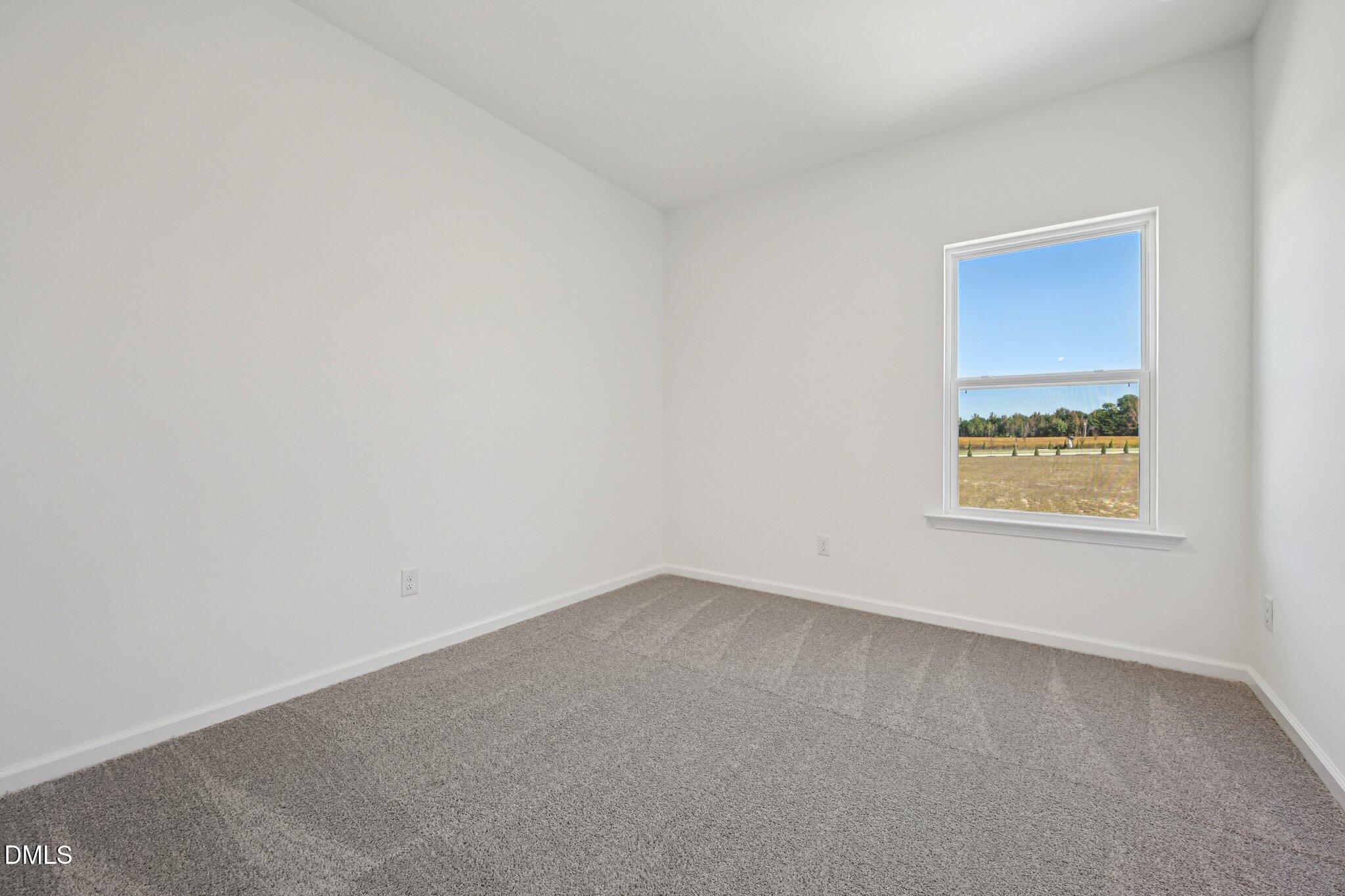 2840 Quarry Road, Unit 174 Rolesville, NC 27571 - Photo 21 of 32 an empty room with a window