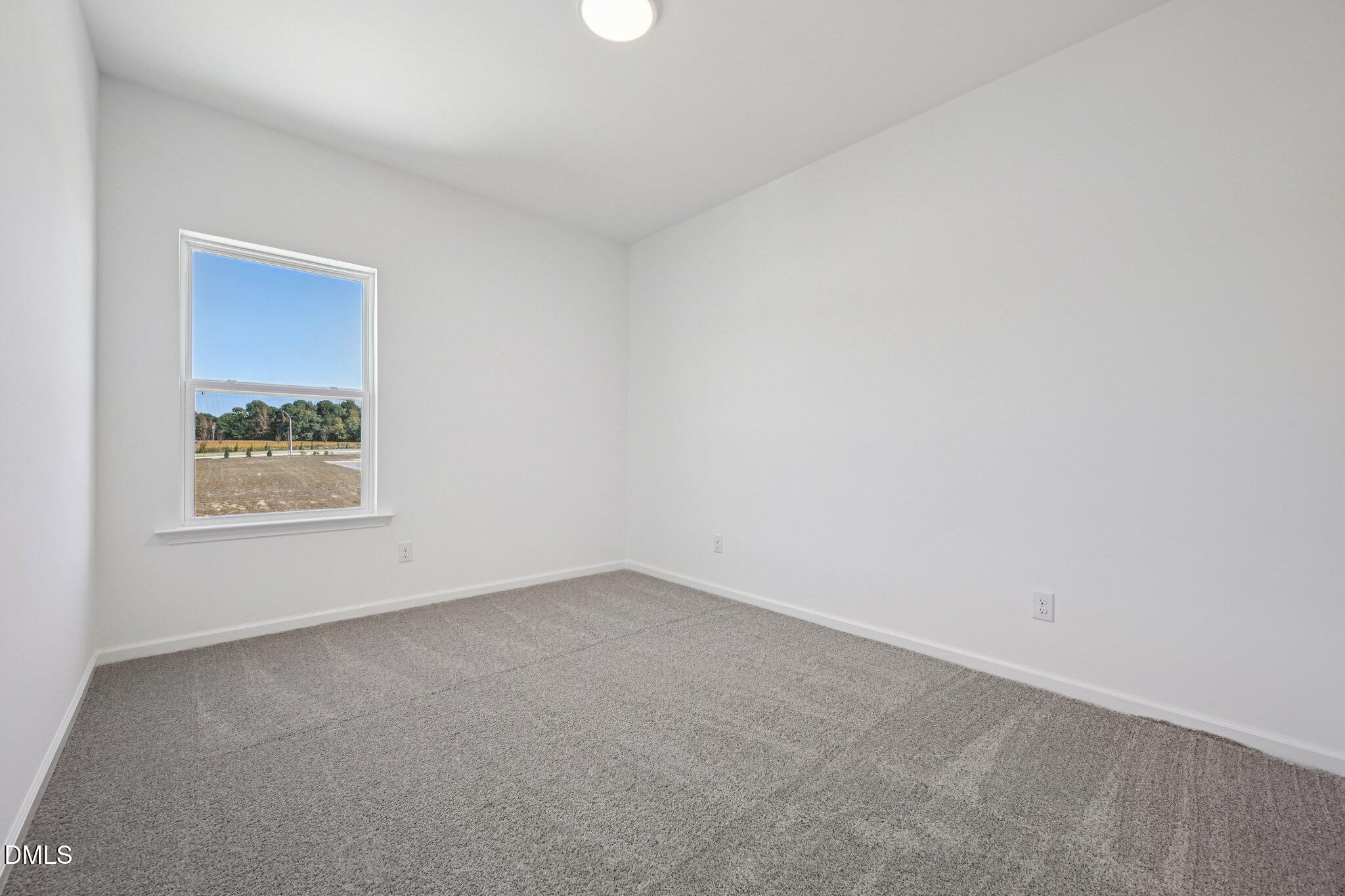 2840 Quarry Road, Unit 174 Rolesville, NC 27571 - Photo 23 of 32 an empty room with windows