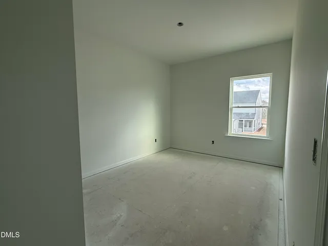 a view of an empty room and closet