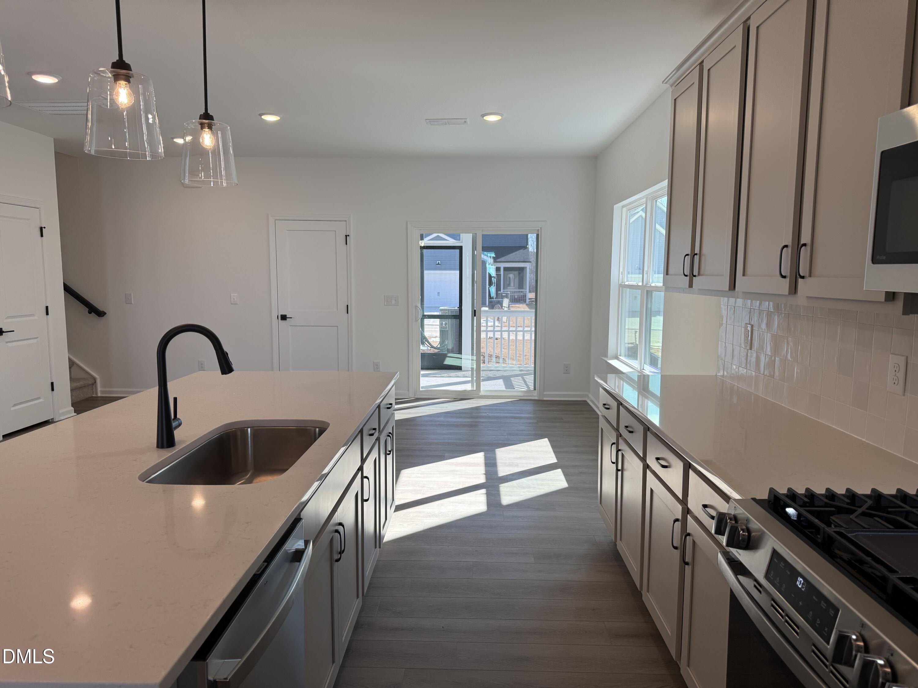 2840 Quarry Road, Unit 174 Rolesville, NC 27571 - Photo 6 of 30 a kitchen that has a lot of cabinets in it