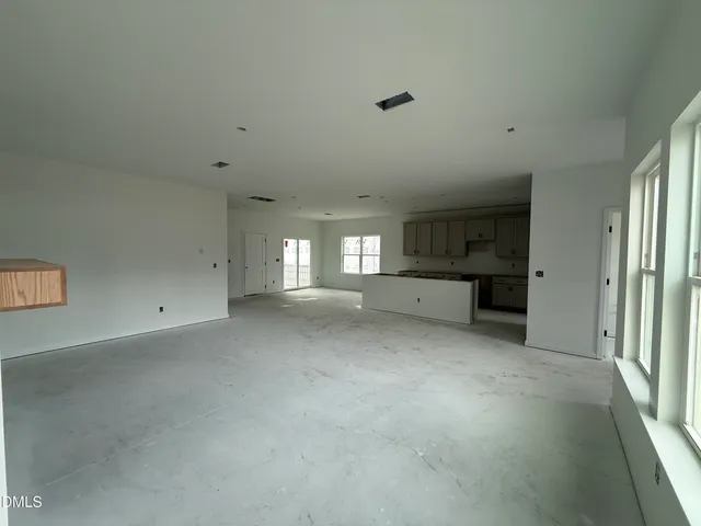 a view of a kitchen with a sink and dishwasher cabinet with wooden floor