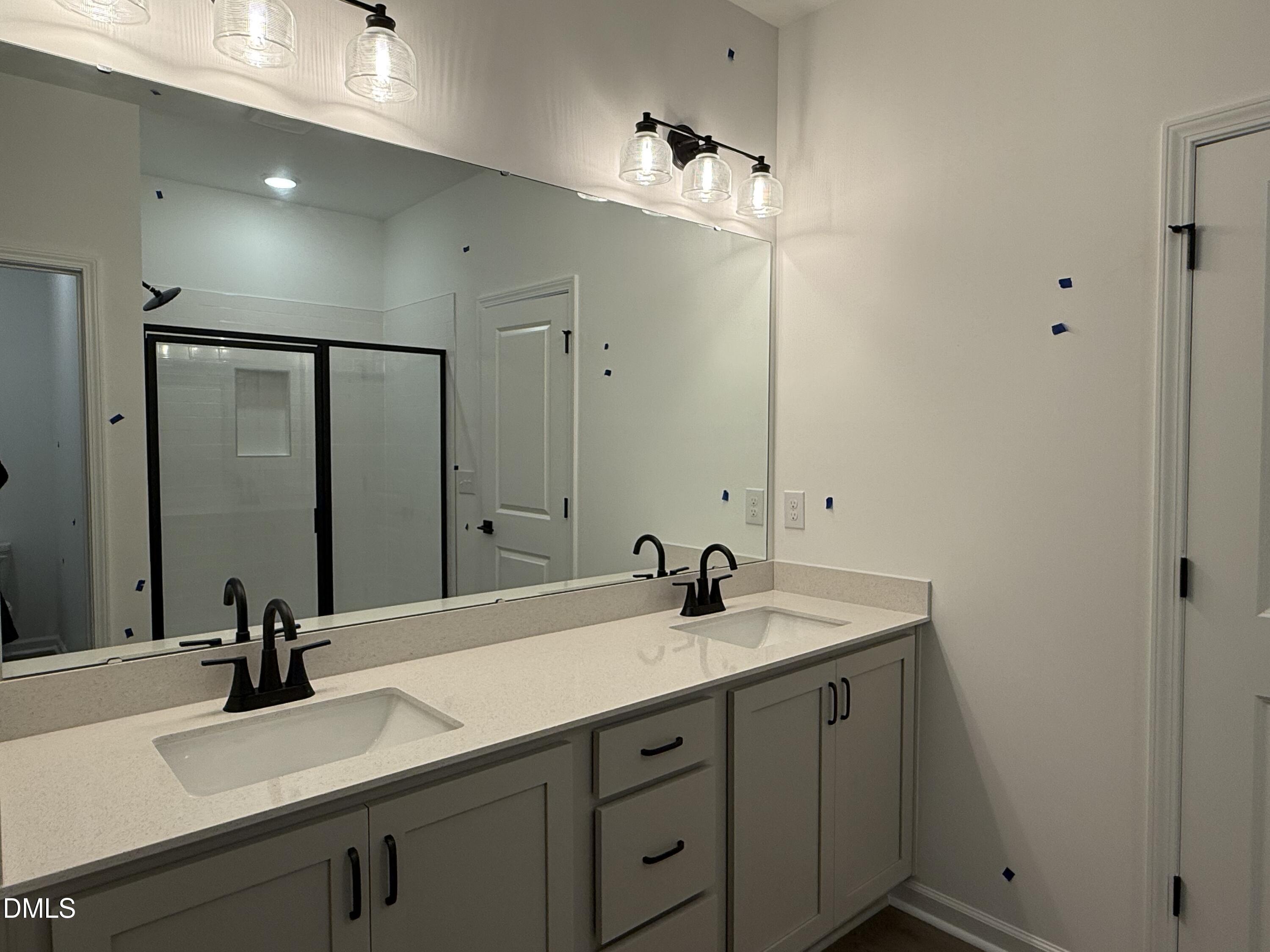 2840 Quarry Road, Unit 174 Rolesville, NC 27571 - Photo 10 of 30 a bathroom with a sink and a mirror
