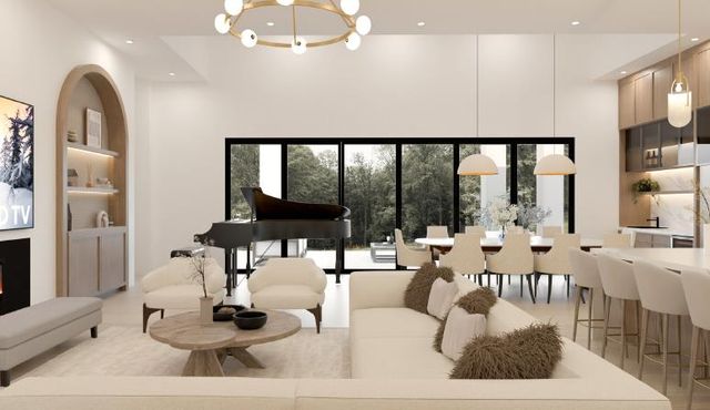 a living room with furniture kitchen view and large windows