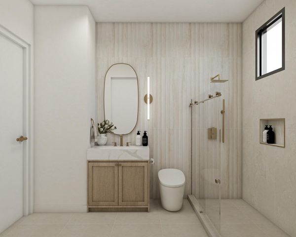 a bathroom with a toilet a sink and shower