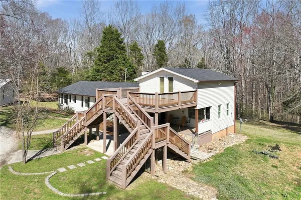 a view of a roof deck with wooden fence and floor