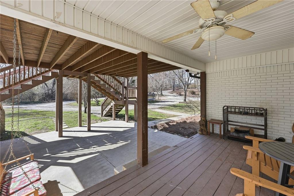4005 Price Road Gainesville, GA 30506 - Photo 16 of 49 a view of a porch with furniture and floor to ceiling window