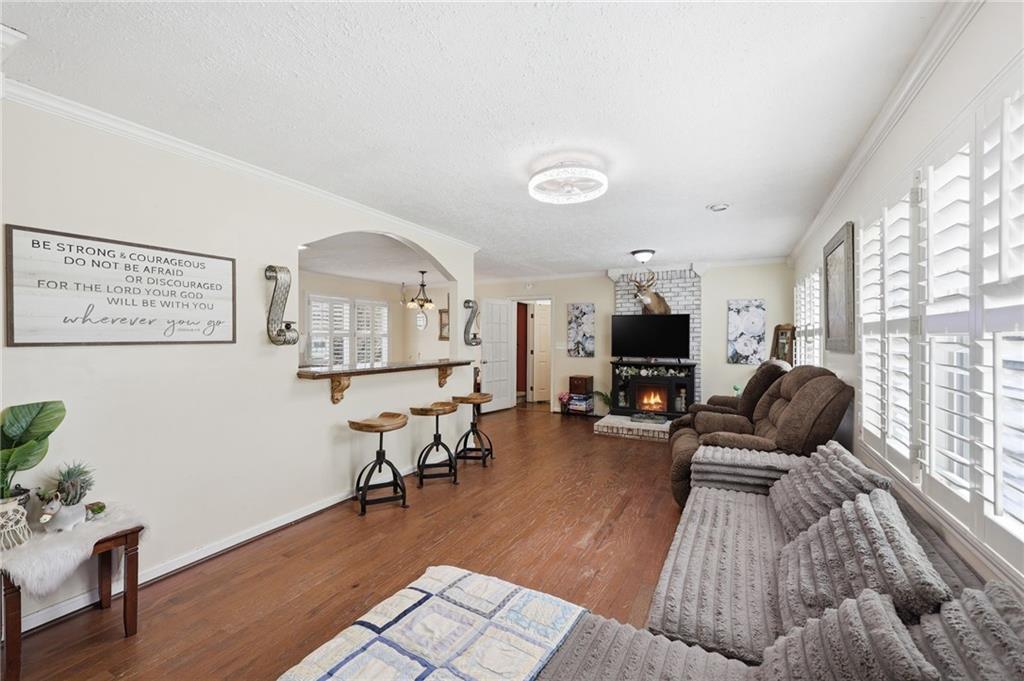 4005 Price Road Gainesville, GA 30506 - Photo 17 of 49 a living room with furniture and a fireplace