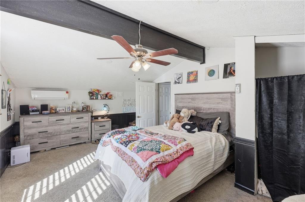 4005 Price Road Gainesville, GA 30506 - Photo 25 of 49 a bedroom with a bed and a fireplace